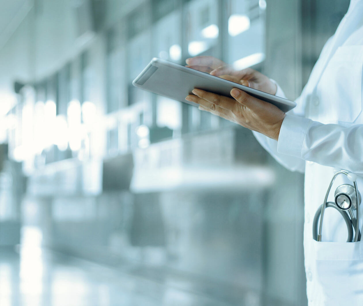 Healthcare and medicine. Medical and technology. Doctor working on digital tablet on hospital background