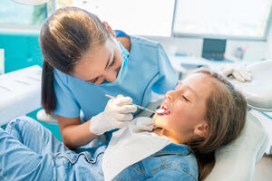 A young child at the dentist.